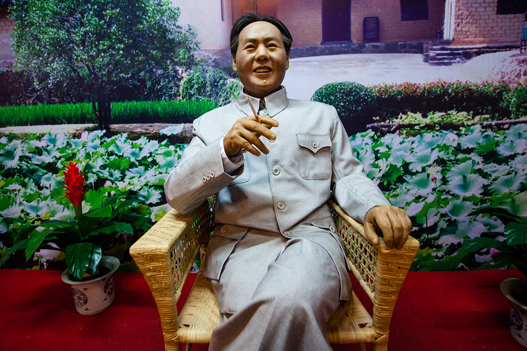 A Mao figurine stands by for photographs in his hometown. - Shaoshan, Hunan