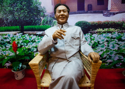 A Mao figurine stands by for photographs in his hometown. - Shaoshan, Hunan