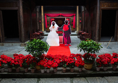 Television character cutouts for a marriage scene standby for tourists on a film set in Hengdian World Studios. - Hengdian, Zhejiang