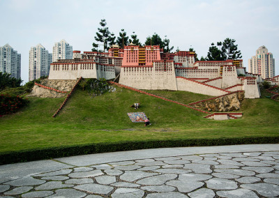 Children play on the lower slopes of a mock Potala Palace in the Splendid China theme park. - Shenzhen, China