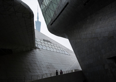 Pedestrian’s walk through the Guangzhou Opera House designed by Zaha Hadid. - Guangzhou, Guangdong