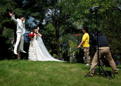 A couple poses for wedding photographs in a park outside of the new Central Business District. - Zhengzhou, Henan